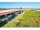 Aerial view of a row of townhouses with private balconies and lush waterfront landscaping at 4013 Catalina Dr # 4013, Bradenton, FL 34210