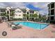 Relaxing community pool with plenty of lounge chairs for residents at 5152 Northridge Rd # 302, Sarasota, FL 34238