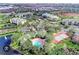 Aerial view of community with pool, tennis court, and pond at 5152 Northridge Rd # 302, Sarasota, FL 34238