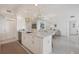 Modern kitchen with white cabinets and island at 800 N Tamiami Trl # 1111, Sarasota, FL 34236