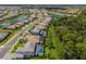 Community overview with houses, roads, lakes, and lush greenery at 16215 Tradewind Ter, Lakewood Ranch, FL 34211