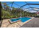 Screened pool and spa with a basketball hoop at 16215 Tradewind Ter, Lakewood Ranch, FL 34211