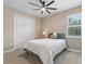 Simple bedroom with a full-size bed and a ceiling fan at 16215 Tradewind Ter, Lakewood Ranch, FL 34211