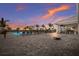 Resort-style pool with lounge chairs and sunset view at 16215 Tradewind Ter, Lakewood Ranch, FL 34211