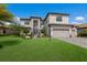 Two-story house with a stone facade and two-car garage at 16215 Tradewind Ter, Lakewood Ranch, FL 34211