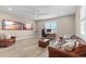 Home office with a large desk, comfortable seating, and two large TV screens at 16215 Tradewind Ter, Lakewood Ranch, FL 34211
