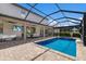 Luxury pool and spa with covered patio and outdoor kitchen at 16215 Tradewind Ter, Lakewood Ranch, FL 34211