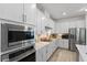 Modern kitchen with stainless steel appliances and white cabinetry at 16215 Tradewind Ter, Lakewood Ranch, FL 34211