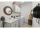 Convenient laundry room with washer, dryer, and extra storage at 16215 Tradewind Ter, Lakewood Ranch, FL 34211