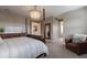 Bright bedroom with a comfortable bed and access to a bathroom and hallway at 16215 Tradewind Ter, Lakewood Ranch, FL 34211