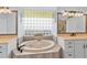 Bathroom boasts a large soaking tub, double vanity, and glass block window at 7301 221St E St, Bradenton, FL 34211