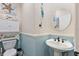 Charming half bathroom with pedestal sink and beach-themed decor at 7301 221St E St, Bradenton, FL 34211