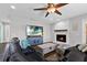 Living room features a stone fireplace and large TV at 7301 221St E St, Bradenton, FL 34211
