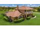 Two-story house with pool and large grassy yard at 7301 221St E St, Bradenton, FL 34211