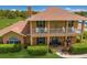 Two-story house with a balcony and landscaped yard at 7301 221St E St, Bradenton, FL 34211