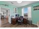 Bright home office with built-in desk and calming, coastal decor at 7301 221St E St, Bradenton, FL 34211