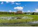 Two story house with a pond in front at 7301 221St E St, Bradenton, FL 34211
