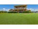 Two-story house with a large lawn and lush landscaping at 7301 221St E St, Bradenton, FL 34211