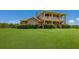 Two-story house with a large lawn and lush landscaping at 7301 221St E St, Bradenton, FL 34211