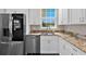 Kitchen with stainless steel appliances and granite countertops at 7301 221St E St, Bradenton, FL 34211