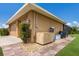 Tan colored garage with generator, AC unit and other equipment at 7301 221St E St, Bradenton, FL 34211