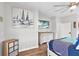 Bedroom with large artwork, dresser, and hardwood floors at 7301 221St E St, Bradenton, FL 34211
