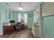 Spacious home office featuring a large desk, comfortable chair, and natural light at 7301 221St E St, Bradenton, FL 34211