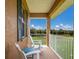Relaxing porch with white chairs and a view of the landscape at 7301 221St E St, Bradenton, FL 34211