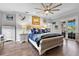 Main bedroom with a comfortable sleigh bed and coastal-themed decor at 7301 221St E St, Bradenton, FL 34211