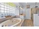 Bathroom features a large soaking tub, double vanity, and walk-in shower at 7301 221St E St, Bradenton, FL 34211