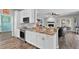 Open kitchen with granite countertops and stainless steel appliances at 7301 221St E St, Bradenton, FL 34211