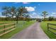 Long driveway leading to a house with RV parked at 7301 221St E St, Bradenton, FL 34211