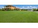 Two story house with large yard, detached garage, and long driveway at 7301 221St E St, Bradenton, FL 34211