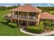 Two-story house with balcony and manicured lawn at 7301 221St E St, Bradenton, FL 34211