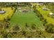 Aerial view of a house on a large lot with a pond at 7301 221St E St, Bradenton, FL 34211
