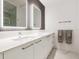 Modern bathroom with double vanity and marble flooring at 111 S Pineapple Ave # 605, Sarasota, FL 34236