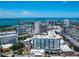 Aerial view of a modern highrise building near the water at 111 S Pineapple Ave # 605, Sarasota, FL 34236