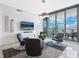 Bright living room with modern furniture and large windows offering city views at 111 S Pineapple Ave # 605, Sarasota, FL 34236