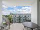 Spacious balcony with city views and comfortable seating at 111 S Pineapple Ave # 605, Sarasota, FL 34236