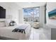 Bright bedroom with a king-size bed and city views at 111 S Pineapple Ave # 605, Sarasota, FL 34236