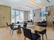 Bright breakfast room with multiple tables and chairs at 111 S Pineapple Ave # 605, Sarasota, FL 34236