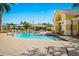 Relaxing community pool with plenty of lounge chairs at 260 Hidden Bay Dr # 202, Osprey, FL 34229