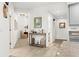 Bright hallway with wood-look floors, leading to various rooms at 260 Hidden Bay Dr # 202, Osprey, FL 34229