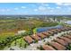 Aerial view highlighting property location near a lake at 24020 Canterwood Way, Venice, FL 34293