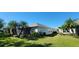 Home features a screened patio and spacious backyard at 4808 Charles Partin Dr, Parrish, FL 34219