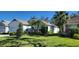 Single-story home with attached garage and lush landscaping at 4808 Charles Partin Dr, Parrish, FL 34219