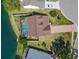 Aerial view of home with screened-in pool, spacious backyard, and lake access at 7209 49Th E Pl, Palmetto, FL 34221