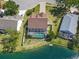 Bird's eye view of a property with a screened-in pool, backing onto a serene lake at 7209 49Th E Pl, Palmetto, FL 34221
