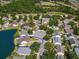Beautiful aerial view of a home with screened-in pool situated on a picturesque lake at 7209 49Th E Pl, Palmetto, FL 34221