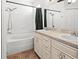 Bathroom with tub, shower, white cabinets, and double sinks at 7209 49Th E Pl, Palmetto, FL 34221